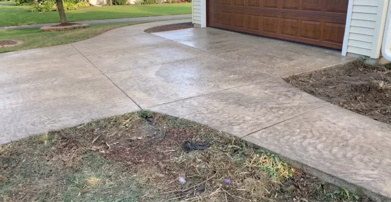 Low-water front yard landscaping with rock and desert plants in Las Cruces